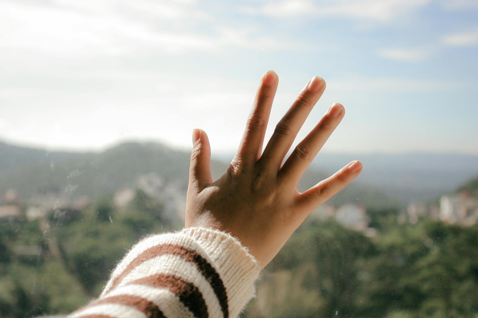 close up photo of hand on glass